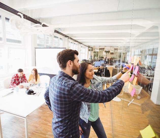 2 people at whiteboard